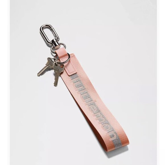 NWT Lululemon Never Lost Keychain Wordmark Pink Mist Silver - Picture 1 of 5